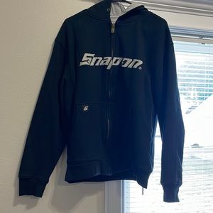 black snap on sweater